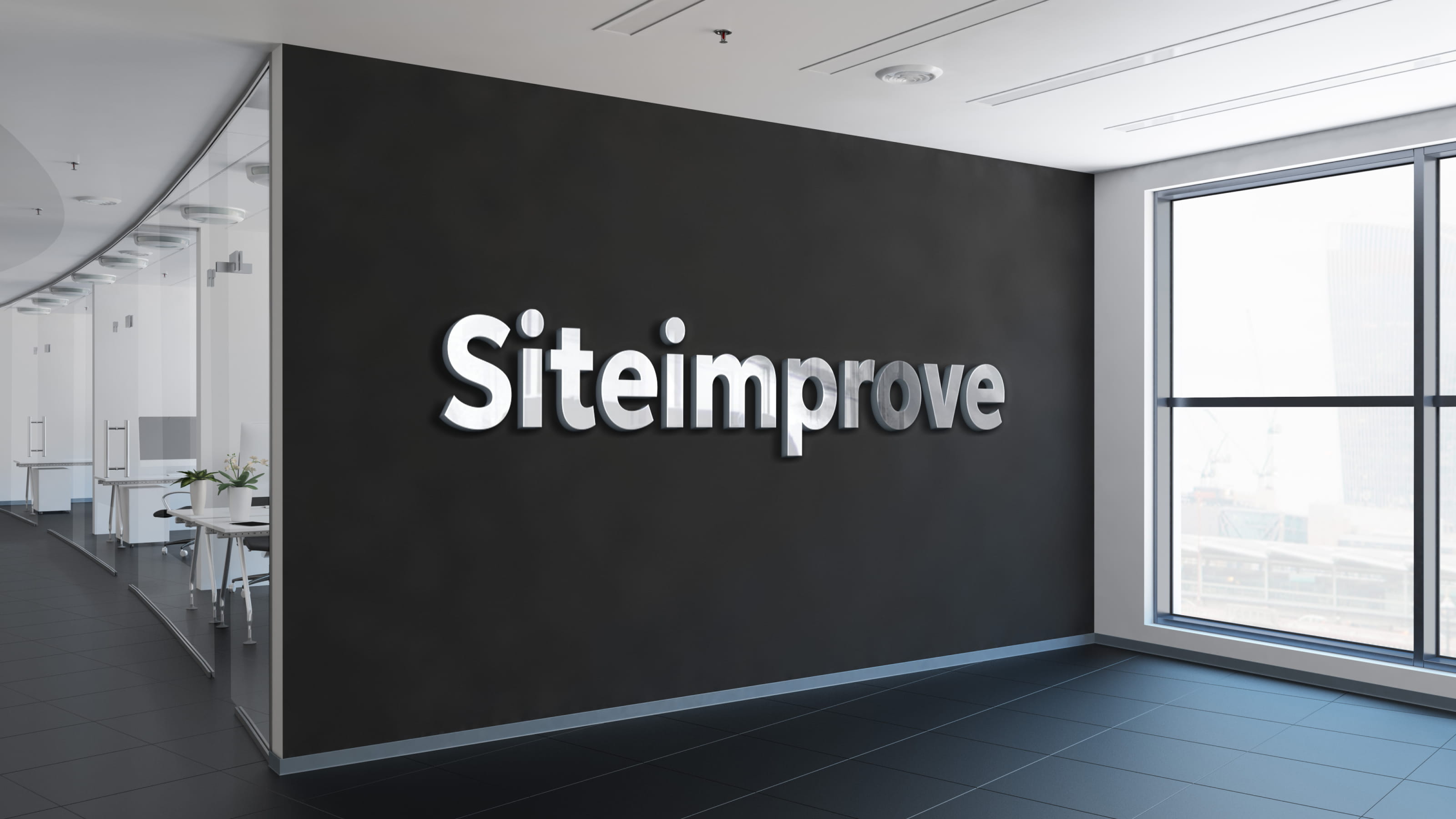 Mockup of the updated Siteimprove logo on an office wall